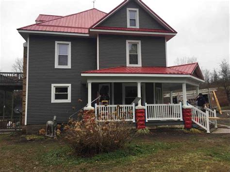 grey house with red metal roof|red roof siding colors.